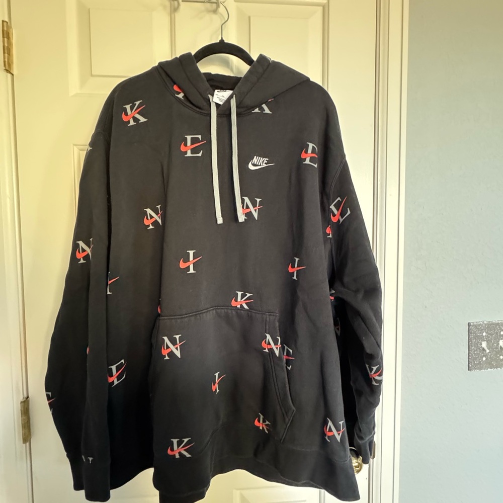 Nike Men's Black Hoodie with Orange and Grey Logo Pattern